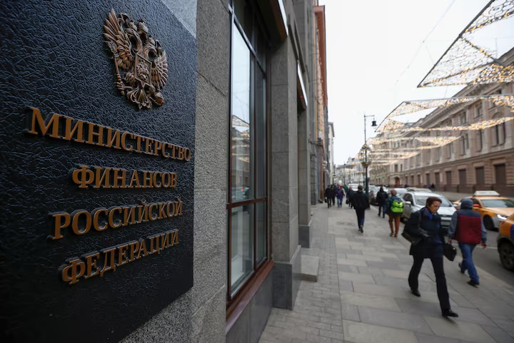 Pedestrians walk past Russia's Finance Ministry building in Moscow